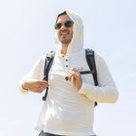 White Sands - Men's Sun Henley with Hideaway Hood worn with the hood up, studio view