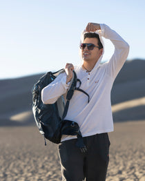 White Sands - Men's Sun Henley with Hideaway Hood in white, worn on desert dunes