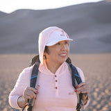 White Sands - Women's Sun Henley with Hideaway Hood, hood up on desert dunes