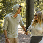 White Sands - Women's Long-Sleeve Hooded Henley in Desert Willow (White) and White Sands - Men’s Long-Sleeve Hooded Henley in Agave (Light Green)