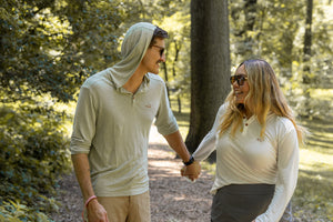 White Sands - Women's Long-Sleeve Hooded Henley in Desert Willow (White) and White Sands - Men’s Long-Sleeve Hooded Henley in Agave (Light Green)