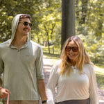 White Sands - Women's Long-Sleeve Hooded Henley in Desert Willow (White) and White Sands - Men’s Long-Sleeve Hooded Henley in Agave (Light Green)