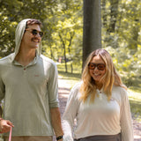 White Sands - Women's Long-Sleeve Hooded Henley in Desert Willow (White) and White Sands - Men’s Long-Sleeve Hooded Henley in Agave (Light Green)