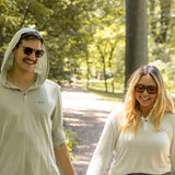 White Sands - Women's Long-Sleeve Hooded Henley in Desert Willow (White) and White Sands - Men’s Long-Sleeve Hooded Henley in Agave (Light Green)