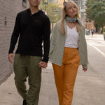 Joshua Tree - Women's Breathable Hemp Trail Pants in Orpiment (Turmeric) and Joshua Tree - Men's Breathable Hemp Trail Pants in Olivine (Green) (front view)