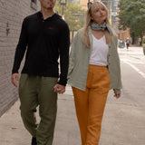 Joshua Tree - Women's Breathable Hemp Trail Pants in Orpiment (Turmeric) and Joshua Tree - Men's Breathable Hemp Trail Pants in Olivine (Green) (front view)