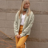Woman wearing Joshua Tree - Women's Breathable Hemp Trail Pants in Orpiment (Turmeric) and Canyonlands - Women’s Long-Sleeve Ventilated Hemp Shirt in Agave (Light Green)