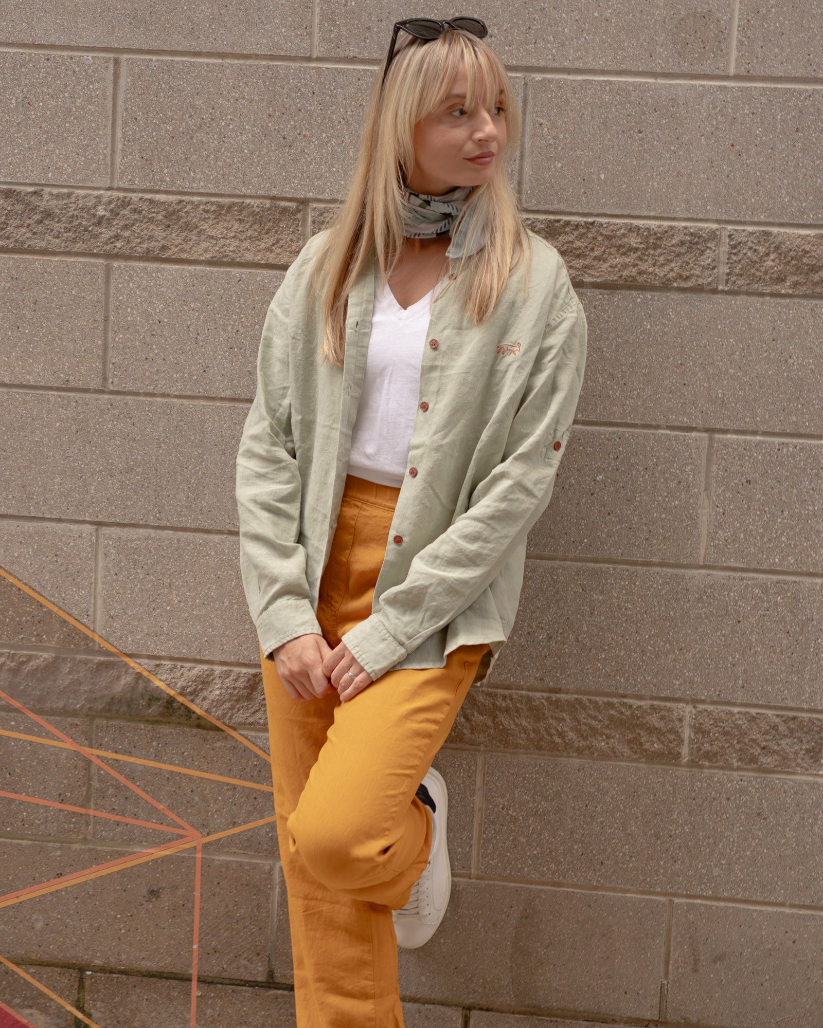 Woman wearing Joshua Tree - Women's Breathable Hemp Trail Pants in Orpiment (Turmeric) and Canyonlands - Women’s Long-Sleeve Ventilated Hemp Shirt in Agave (Light Green)