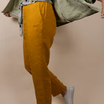Joshua Tree - Women's Breathable Hemp Trail Pants in Orpiment (Turmeric), studio view