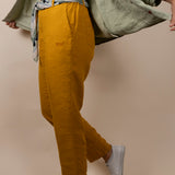 Joshua Tree - Women's Breathable Hemp Trail Pants in Orpiment (Turmeric), studio view