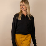 White Sands - Women's Long-Sleeve Hooded Henley in Obsidian (Black) (Front view)