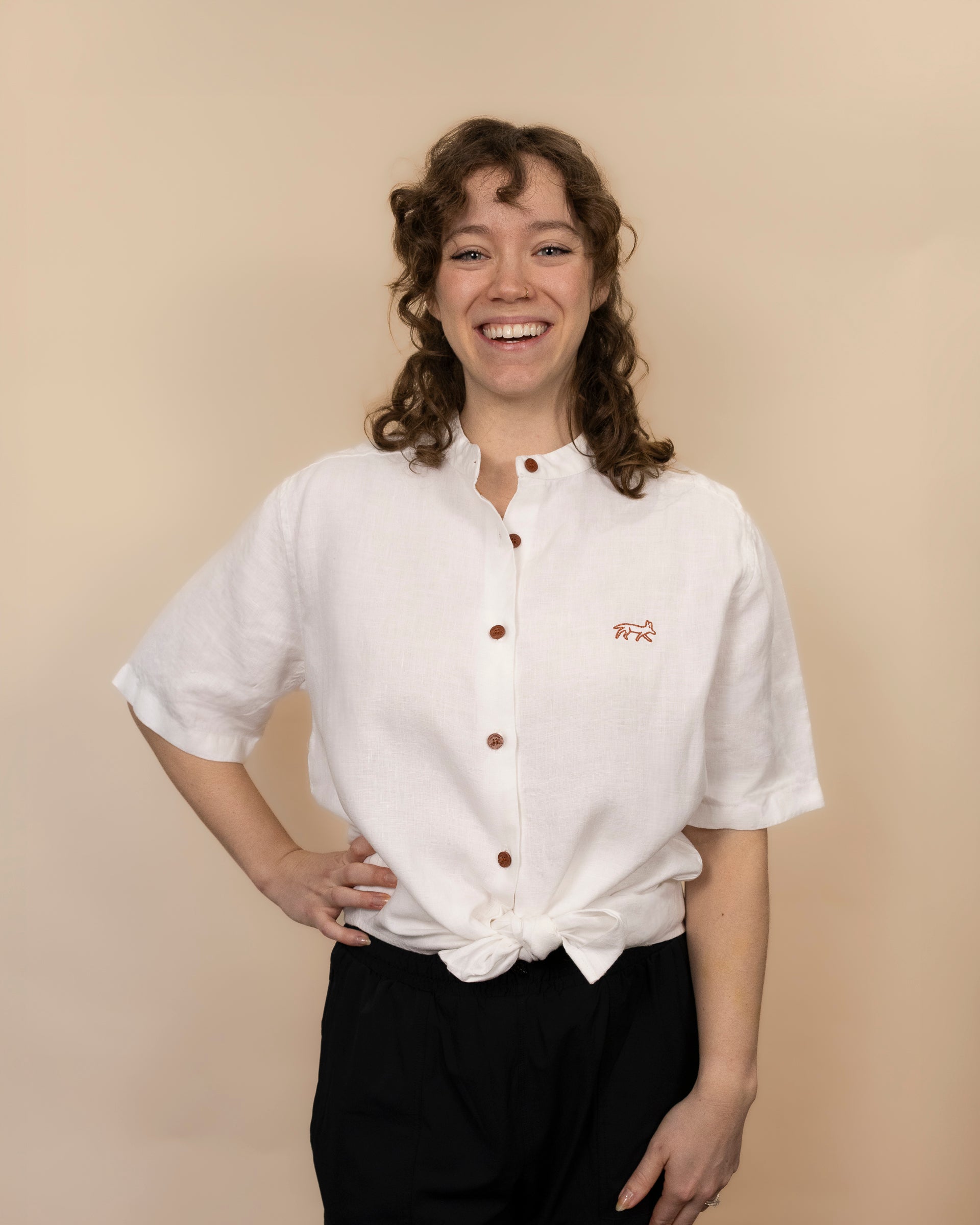 Everglades - Women's Ventilated Short Sleeve Hemp Shirt in white, knotted at the waist, studio view