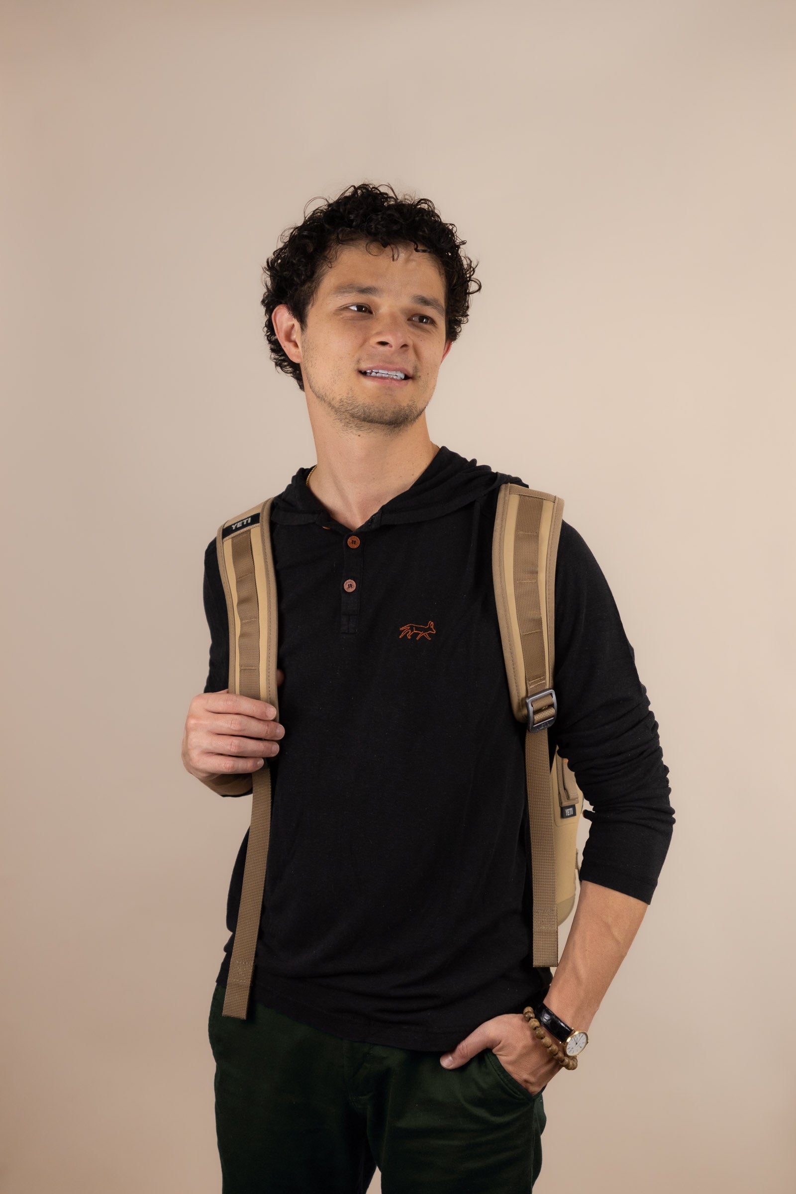 White Sands - Men's Long-Sleeve Hooded Henley in Ironwood (Black) (front view with backpack)