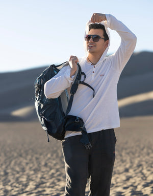 Man with a backpack in a desert setting